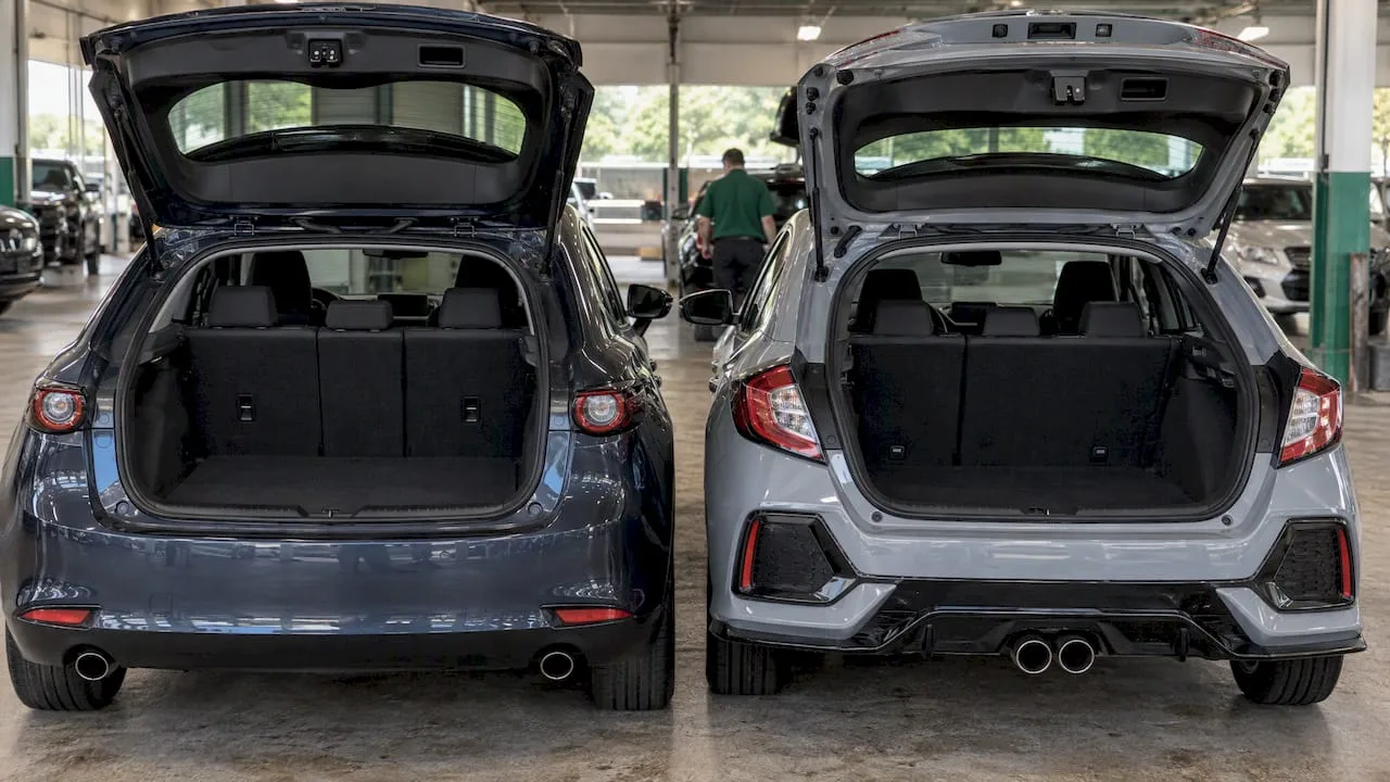 Open Mazda3 and Civic hatchback cargo areas