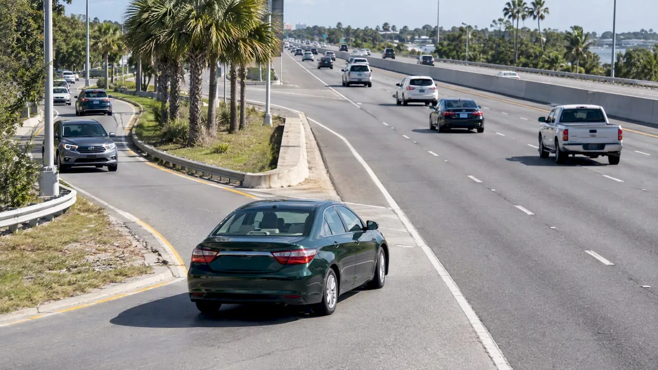 Green car merging onto a Clearwater highway